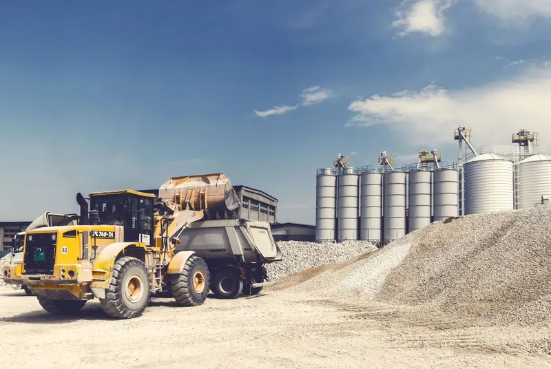 Loader filling a trailer at a gravel and crushed-rock yard